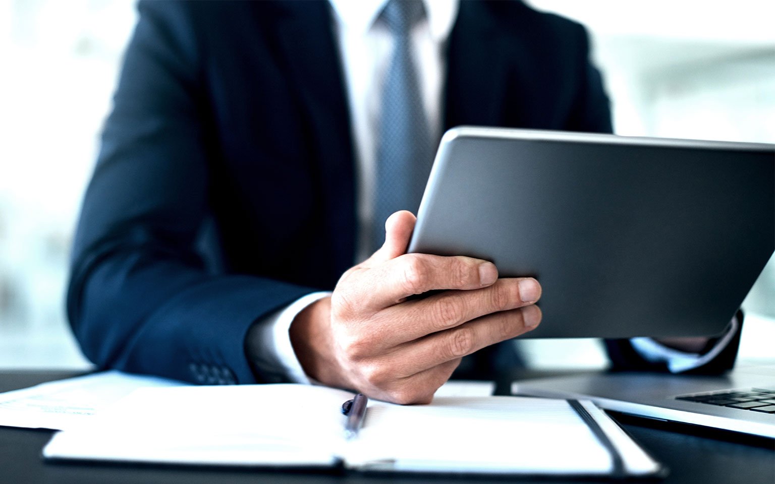 businessman on tablet