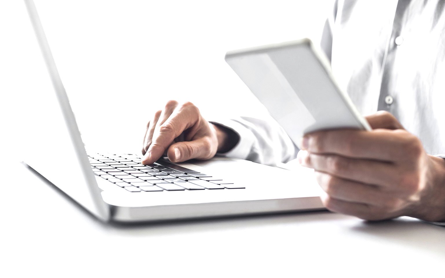 Doctor typing on a laptop