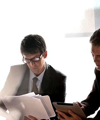 Optimise your valuable time: Printing made easy men looking into papers