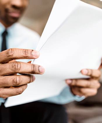 man looking to papers